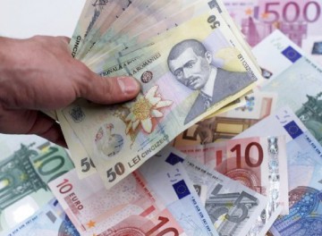 Francul elveţian a scăzut cu 3 bani, la 4,1611 lei